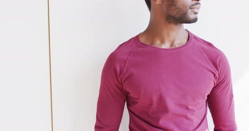 Man Smiles and Looks at Camera Indoors