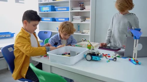 Robotics Programming Class Children Construct and Code Robot STEM Education Using Constructor Blocks