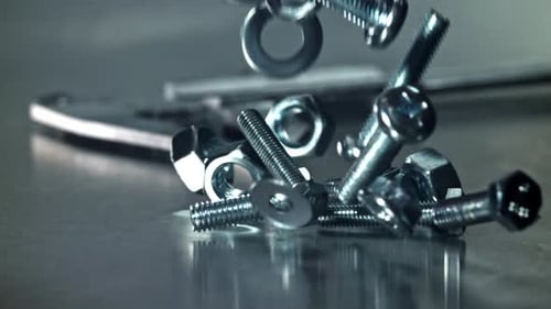 Falling Nuts Bolts and Washers on a Metal Table Filmed on a Highspeed Camera at 1000 Fps
