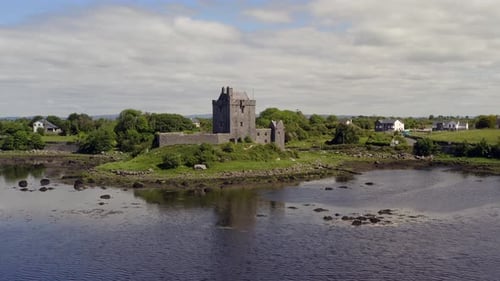 Peaceful Dunguaire Castle reflected on the water