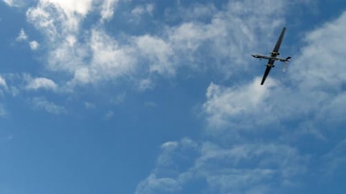 Fixed-Wing Drone Flying in a Blue Sky