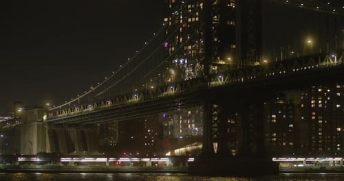 Brooklyn bridge at night, skyline of New York, NYC citylights, skyscrapers in background