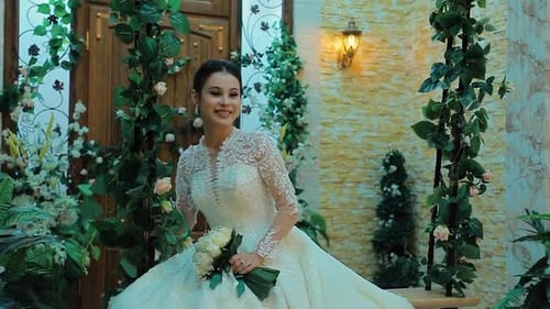 Woman in Wedding Dress Smiling at the Camera