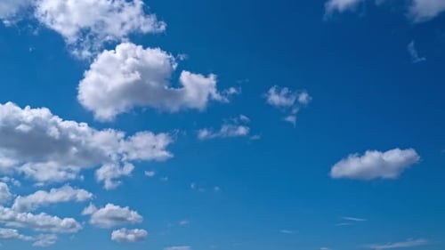 Sky Timelapse Moving Clouds and Sun White Fluffy Clouds Slowly Float Through the Blue Daytime Sky