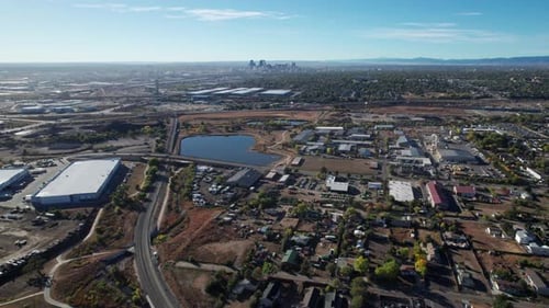 Drone shot panning up of industrial park in Denver, CO on a sunny day