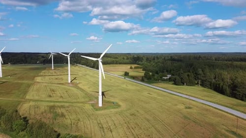 Aerial View of Wind Farm or Wind Park, With High Wind Turbines for Generation Electricity 4K UHD