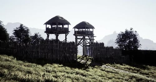 Wooden Towers Guard Ancient Forts in a Serene Landscape
