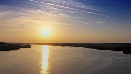 Landscape with sunset over river. Aerial view of sunset time river water horizon