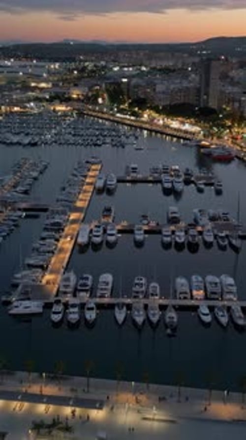 Aerial drone view of the Port of Alicante at sunset. Vertical