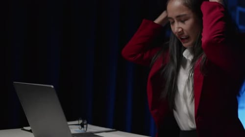 Businesswoman is seriously stressed working overtime bored and burnout due to office syndrome