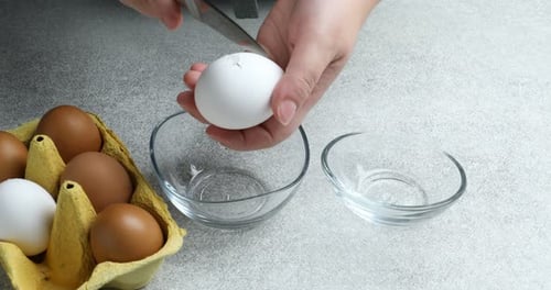 Separating Egg White and Yolk into Glass Bowls