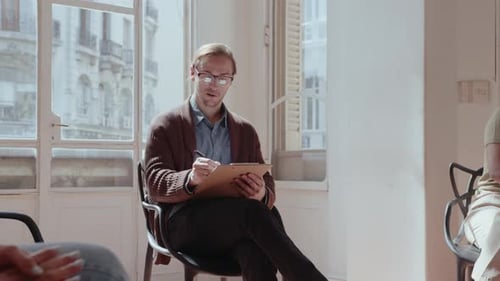 Therapist Talking to Patient in Sunlit Room