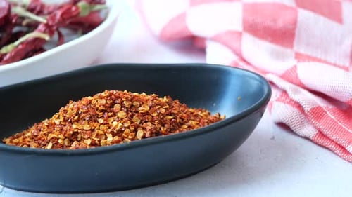 Chili Flakes in a Bowl on Table