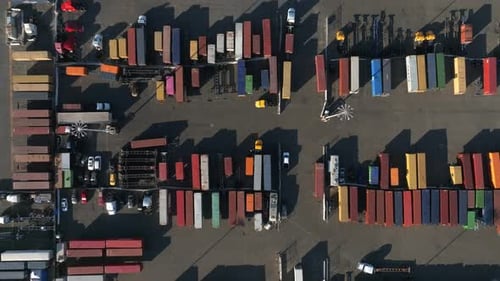 Logistics and Transportation of Container Cargo Ship with Working Crane Bridge in Shipyard