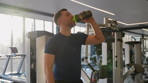 Man Drinking Protein Shake in Gym