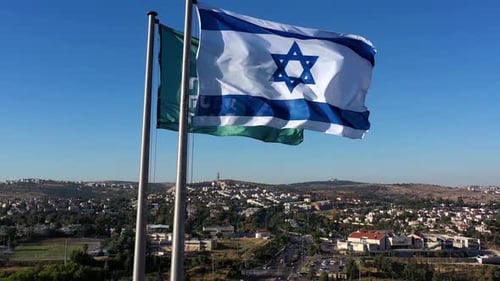 Israeli Flag Waving Over an Urban Landscape