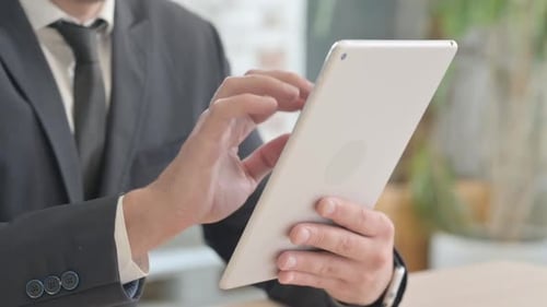 Close up of Businessman Hand Using Tablet PC