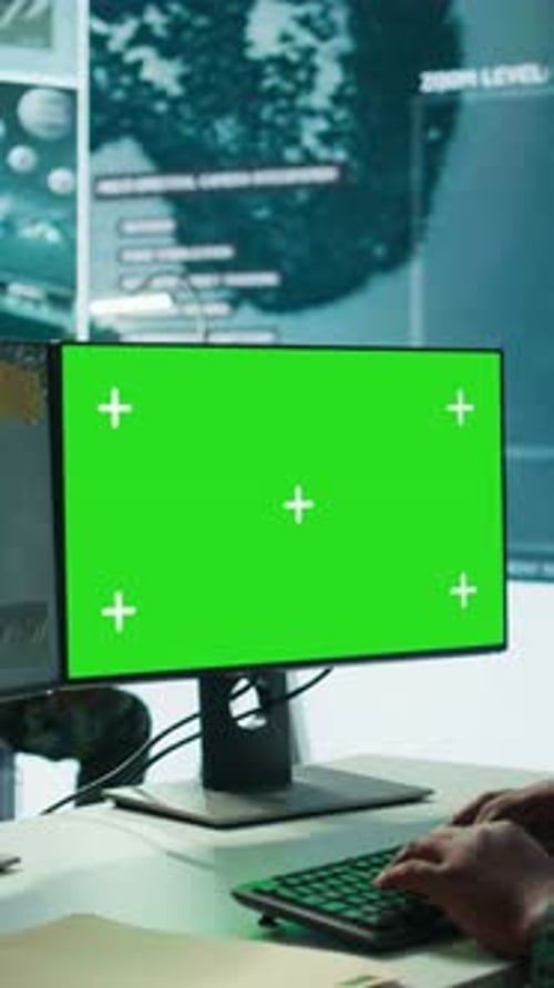Computer with Green Screen in Futuristic Workplace