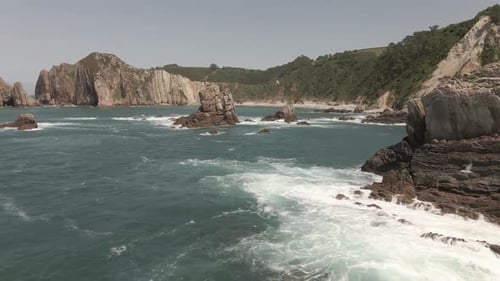 Bird Eye View of the Sea Water with the Beach in the Background in Spain