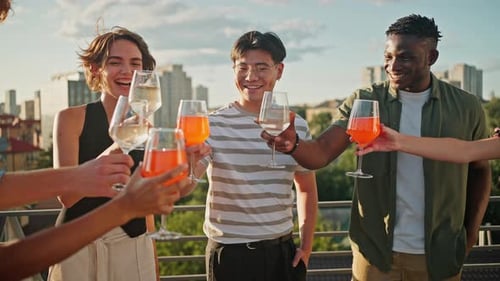 Carefree Young People Having Party on Terrace with Drinks