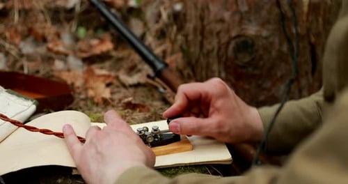 Close Up Using Morse Code Transmitter in Forest