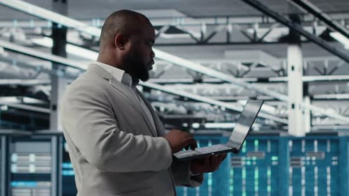 Smiling Data Center Technician Installing and Upgrading Hardware Components