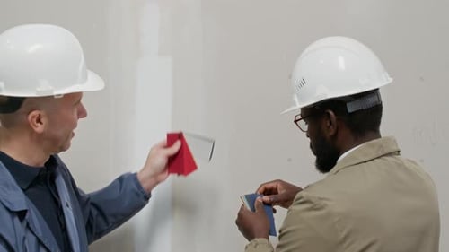Construction Workers Choosing Paint Colors at Job Site