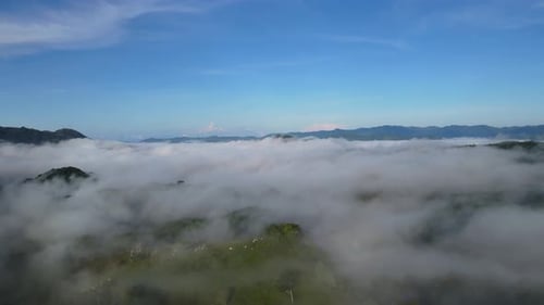 Aerial Drone Above White Fluffy Clouds Against Blue Sky Background, 4K