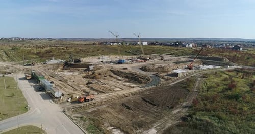 Trucks are Working at the Construction Site