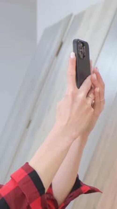 Close Up of Woman Holding Mobile Phone