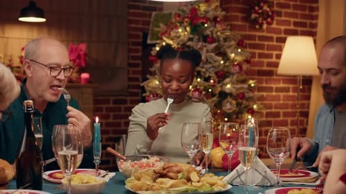 Family Celebrates Christmas Dinner Together at Home