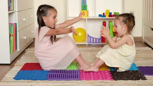 Two Little Girls Clapping Hands Together Playfully