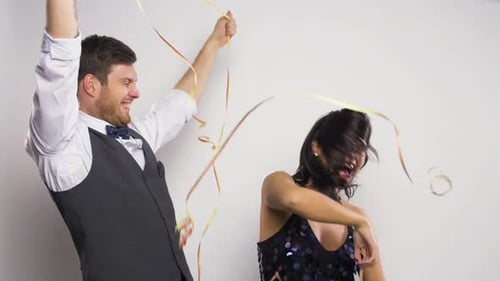 Happy Young Adults Celebrating with Confetti