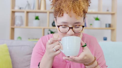 Woman Drinking from Mug in Home Interior