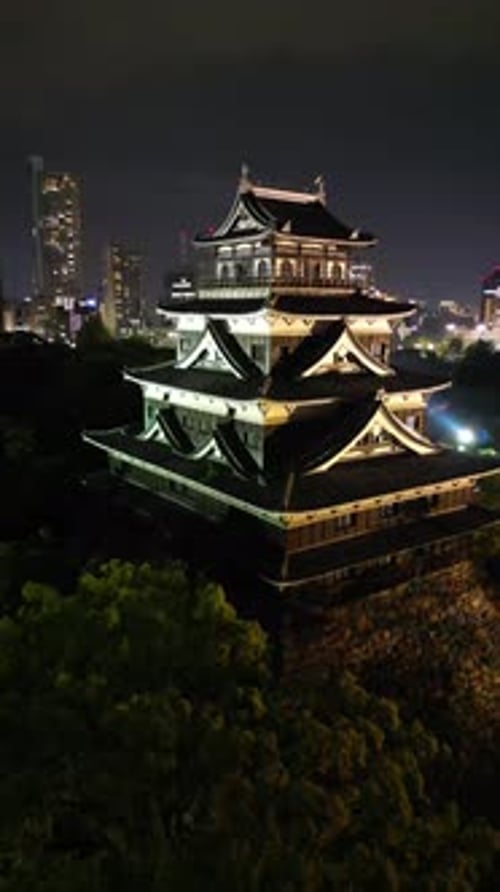 Aerial video of the Hiroshima skyline with Hiroshima Castle in Japan
