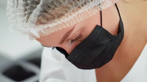 Woman Wearing Mask in Medical Workplace