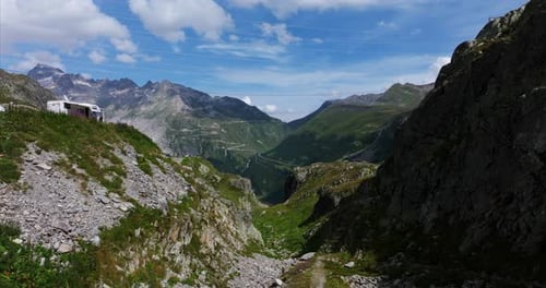Grimselpass or Grimsel Pass in summertime, Switzerland, tourists with motorhome, viewpoint. Aerial