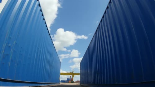 Motion Between Blue Big Containers in Blue Sky Background
