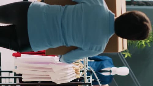 Manager Helping Courier with Packages