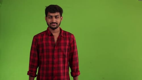 Young Adult Presenting Against Green Screen Backdrop