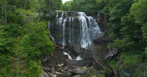 Beautiful Landscape of High Waterfall with Falling Down Clear Water From Rocky Boulders Between