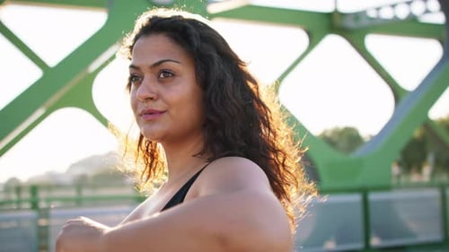 Close Up of Young Overweight Woman Exercising Outdoors in Bridge