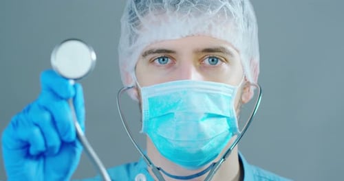 Close up of doctor holding stethoscope