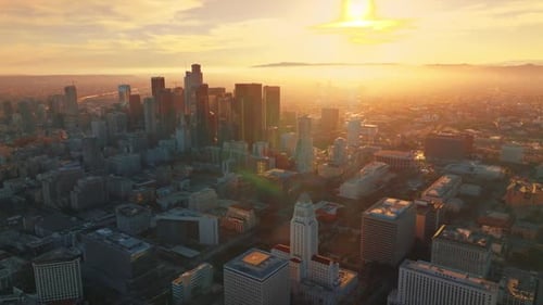 Wonderful panorama of contemporary Los Angeles at sunset. Hazy skyline in the bright light