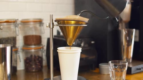 Pouring water to make drip coffee in 4k