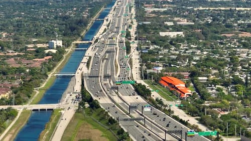 Aerial View of American Freeway with Many Driving Cars During Rush Hour in Miami Florida View From