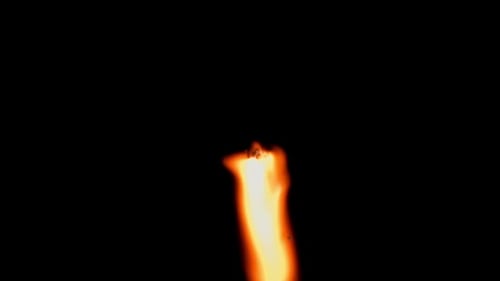 Close-up of mesmerizing fire flame against black background