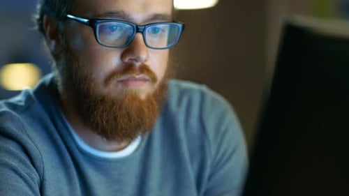 Talented Young Concept Artist Drawing on a Digital Pen Display Tablet While Sitting at His Working