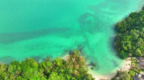 Aerial view: Tropical paradise, crystal waters. 4K.
