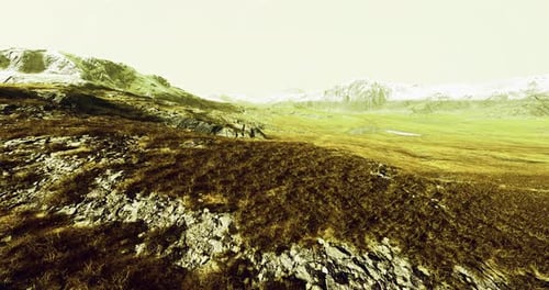 Vast Mountainous Landscape Showcasing Rugged Terrain and Grassy Plains